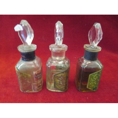 201 - SET OF THREE EARLY 20TH CENTURY FRENCH GLASS SCENT BOTTLES WITH CONTENTS AND STOPPERS:- 