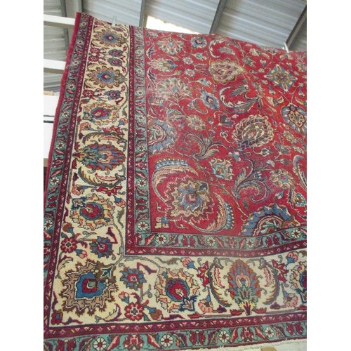 257A - A SUPERB AND VERY LARGE VINTAGE TABRIZ CARPET WITH RED GROUND AND FOLIATE PATTERNED FIELD, CREAM AND... 