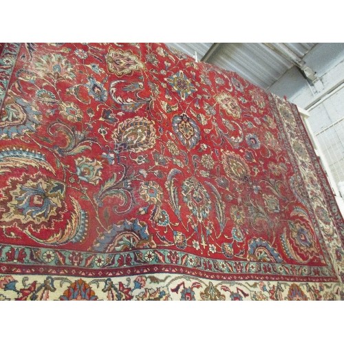 257A - A SUPERB AND VERY LARGE VINTAGE TABRIZ CARPET WITH RED GROUND AND FOLIATE PATTERNED FIELD, CREAM AND... 