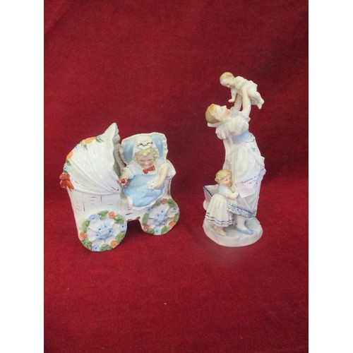 173A - TWO VICTORIAN PORCELAIN FIGURES - CHILD IN PRAM AND MOTHER HOLDING A BABY