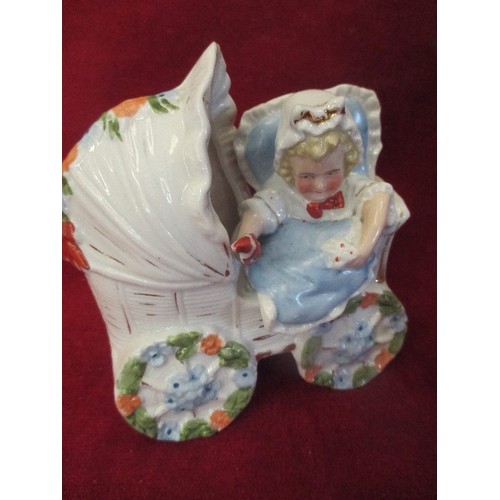 173A - TWO VICTORIAN PORCELAIN FIGURES - CHILD IN PRAM AND MOTHER HOLDING A BABY