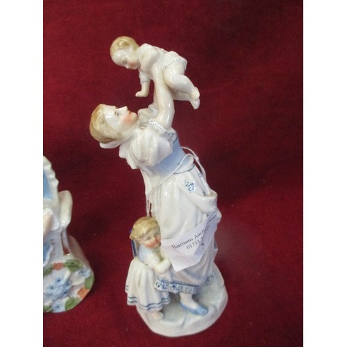 173A - TWO VICTORIAN PORCELAIN FIGURES - CHILD IN PRAM AND MOTHER HOLDING A BABY