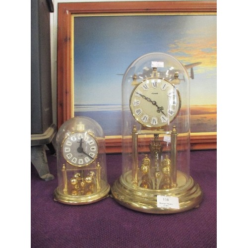 116 - ANNIVERSARY CLOCKS UNDER DOMES, A LARGE AND A SMALL. BOTH BY KUNDO GERMANY - TALLEST 29CM H.
