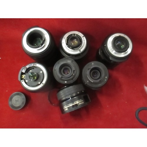 228 - 6 X NIKON CAMERA LENSES AND SOME HOODS. INCLUDES A DX NIKKOR 55-200, A DX SWM VR ED ASPHERICAL, AND ... 