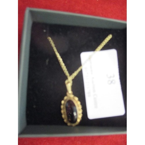 38 - GOOD QUALITY PENDANT WITH A SMOKEY QUARTZ, SET IN 1/20 12K GOLD PLATE , THE CHAIN ALSO MARKED 1/10 1... 
