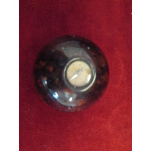 68 - SMALL COMPASS CONTAINED IN HEAVY BROWN MOTTLED PAPERWEIGHT.