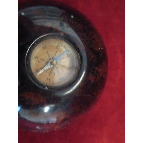 68 - SMALL COMPASS CONTAINED IN HEAVY BROWN MOTTLED PAPERWEIGHT.