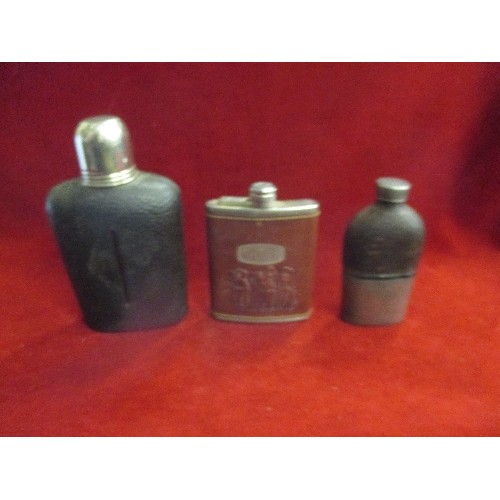 22 - THREE VINTAGE LEATHER COVERED SPIRIT FLASKS, THE LARGEST WITH STIRRUP CUP LID, A GOLFING ONE AND A B... 