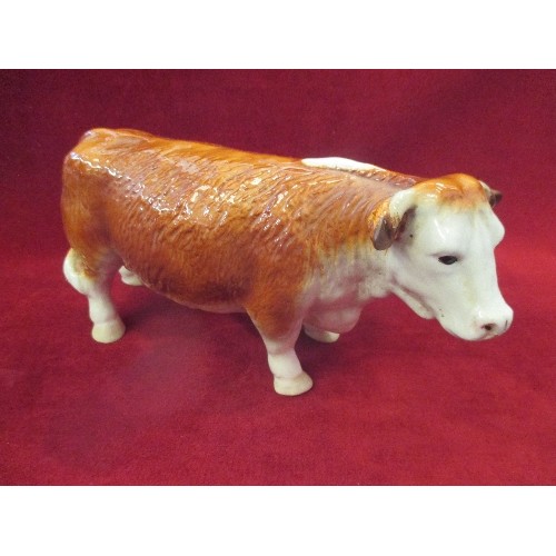 102 - LARGE CERAMIC COW FIGURE. MADE IN ENGLAND.