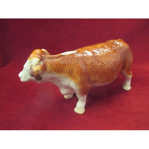 102 - LARGE CERAMIC COW FIGURE. MADE IN ENGLAND.