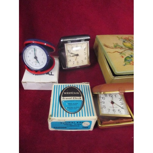 227 - VINTAGE TIN CONTAINING TRAVEL CLOCKS, CARRIAGE CLOCK AND POCKET WATCHES.