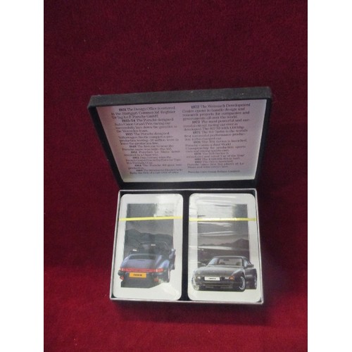 309 - A MINT SET OF PORSCHE PLAYING CARDS - 2 DECKS . SEALED IN PACKAGING, IN ORIGINAL BOX WITH BRIEF HIST... 