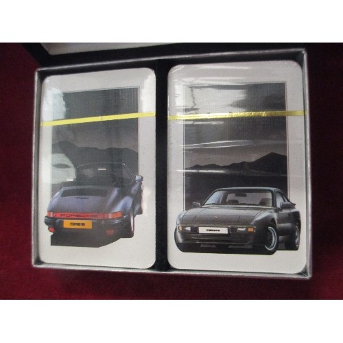 309 - A MINT SET OF PORSCHE PLAYING CARDS - 2 DECKS . SEALED IN PACKAGING, IN ORIGINAL BOX WITH BRIEF HIST... 