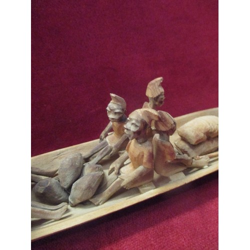 9 - AN INTERESTING 20TH CENTURY AFRICAN  HAND CARVED WOODEN CANOE WITH 10 FIGURES WITH PRODUCE - SACKS A... 