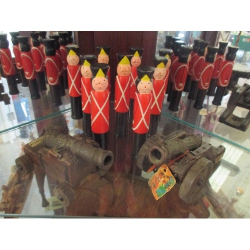 17 - NINE HAND PAINTED SOLDIER SKITTLES AND TWO VINTAGE SPANISH CANONS IN WOOD & METAL, ONE MARKED 