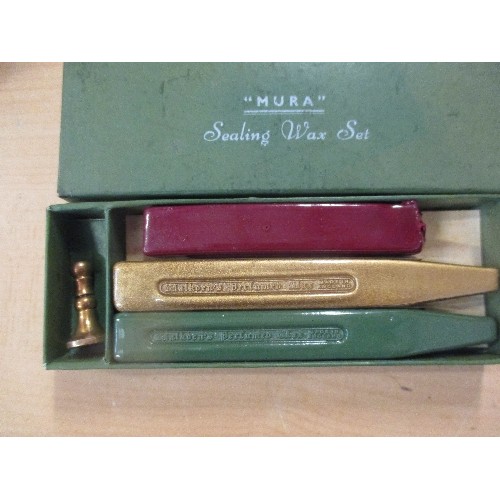 206 - A VINTAGE SEALING WAX SET BY MURA WITH RED, GREEN AND GOLD WAX STICKS. THE SEAL WITH THE DESIGN OF A... 