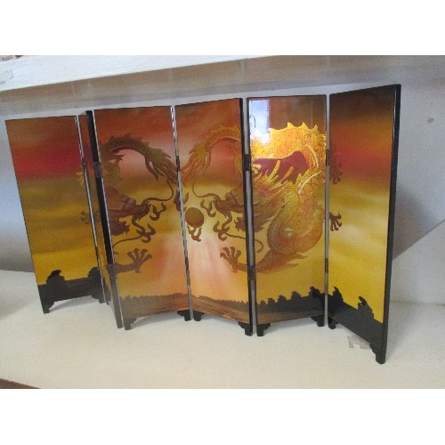 93 - A CHINESE LACQUERED SIX FOLD TABLE SCREEN WITH GILT DRAGON DESIGN (24CM X 46CM)