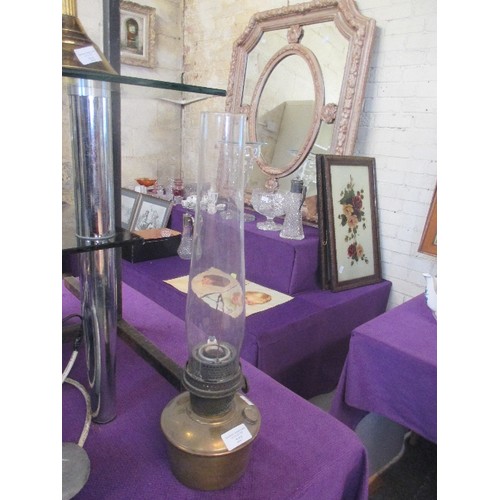 227 - A VINTAGE BRASS ALADDIN OIL LAMP WITH GLASS CHIMNEY