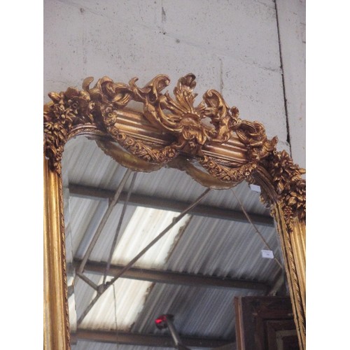 190 - AN IMPRESSIVE FRENCH STYLE GILDED MIRROR WITH APPLIED ROCOCO STYLE MOULDING TO THE ARCHED TOP, SWAGS... 