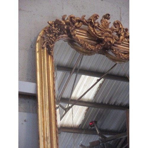 190 - AN IMPRESSIVE FRENCH STYLE GILDED MIRROR WITH APPLIED ROCOCO STYLE MOULDING TO THE ARCHED TOP, SWAGS... 