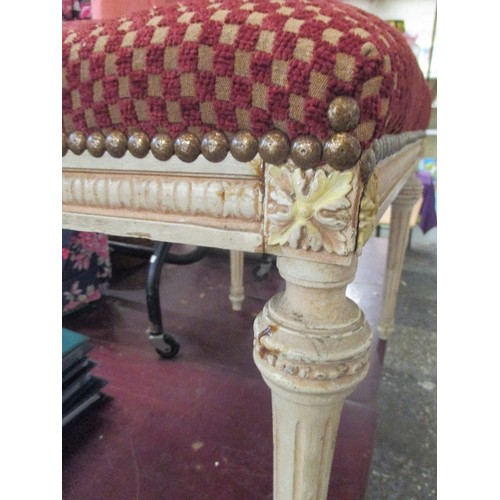 207A - A REGENCY STYLE DRESSING STOOL, FLUTED LEGS AND CARVED DECORATION IN A DISTRESSED IVORY PAINT FINISH... 