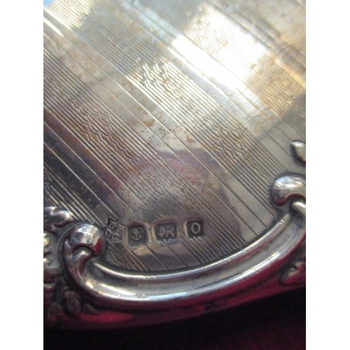 84 - STERLING SILVER DRESSING TABLE MIRROR, HALLMARKED BIRM 1913, ENGINE TURNED AND EMBOSSED FLORAL & SCR... 