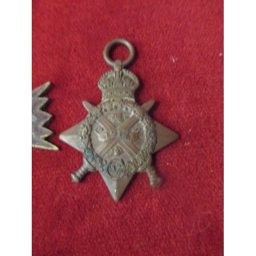 104 - A LARGE BRASS MILITARY TYPE STAR WITH BLUE AND RED ENAMEL, TOGETHER WITH A WW1 1915 /15 STAR ENGRAVE... 