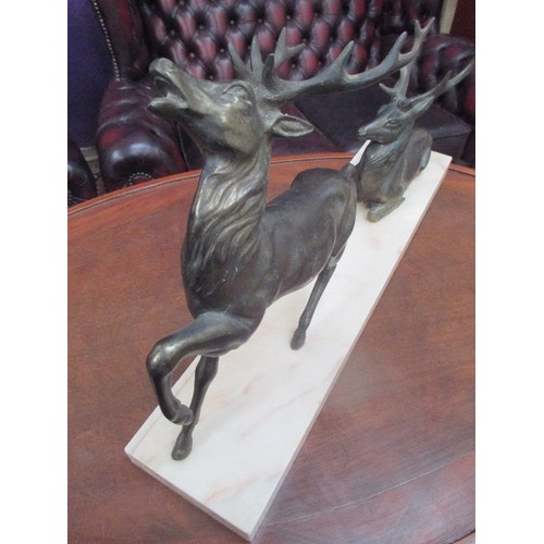 210 - AN IMPRESSIVE 1930'S FRENCH ART DECO PERIOD GROUP OF TWO STAGS - IN BRONZED METAL ON A HEAVY MARBLE ... 