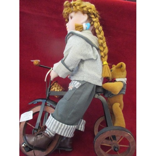 105 - COLLECTORS DOLL 'ABBEY' ON TRICYCLE WITH TEDDY BEAR HANGING ON THE BACK