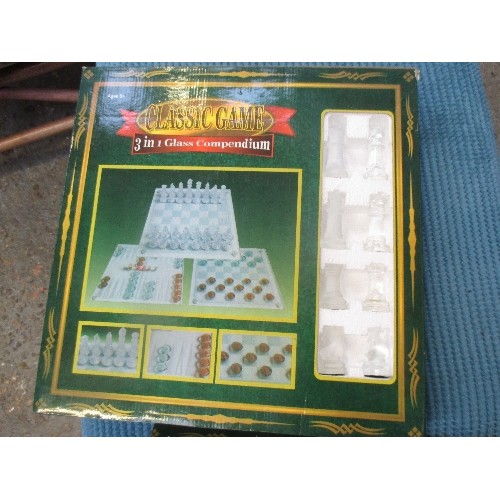 135 - THREE IN ONE GLASS COMPENDIUM OF CHESS, DRAUGHTS AND BACKGAMMON - TWO SETS - BOXED AS NEW