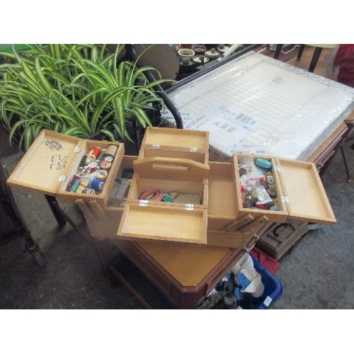 227 - WOODEN CANTILEVER SEWING BOX WITH CONTENTS OF THREADS, BUTTONS, SCISSORs & OTHER SEWING ACCESSORIES