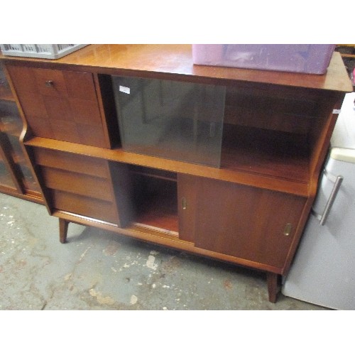 267 - MID CENTURY TEAK SIDEBOARD WITH DROP DOWN CABINET, GLASS SLIDING DOORS, CUTLERY DRAWER - ON SPLAYED ... 