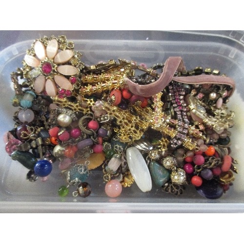 317 - TWO TUBS OF COSTUME JEWELLERY BEADS & CHAINS