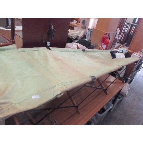 334 - VINTAGE CAMPAIGN MILITARY CANVAS CAMP BED ON A FOLDING WOOD AND METAL BASE