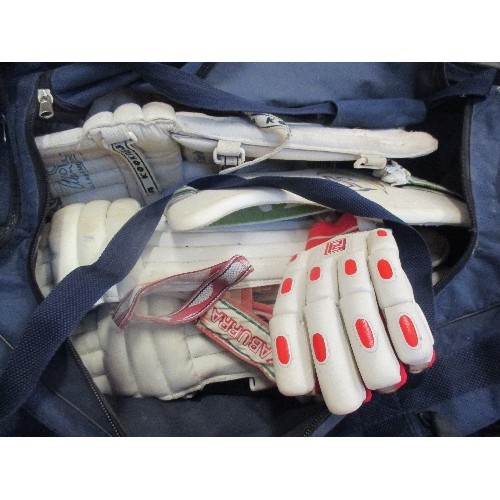 332 - LARGE SPORTS BAG BY PEAK SPORTS WITH CONTENTS OF CRICKET SHIN PADS AND GLOVES