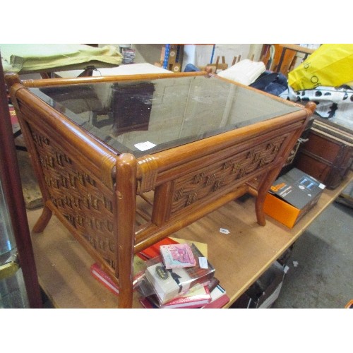 325 - CANE AND RATTAN COFFEE TABLE WITH SMOKEY GLASS TOP AND MAGAZINE SHELF BELOW