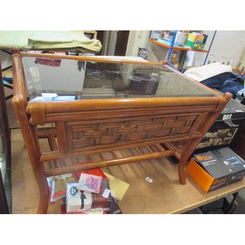 325 - CANE AND RATTAN COFFEE TABLE WITH SMOKEY GLASS TOP AND MAGAZINE SHELF BELOW