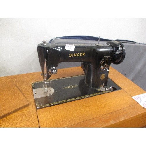 368 - ELECTRIC SINGER SEWING MACHINE IN SEWING TABLE WITH DRAWERS  - NOTE FRONT LEG IS DETACHED AND NEEDS ... 