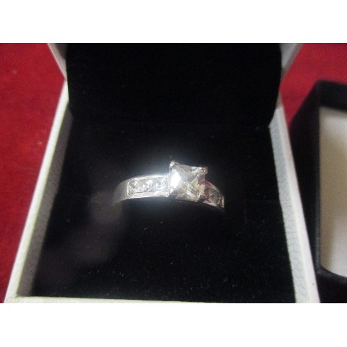 19 - TWO 925 SILVER RINGS, ONE WITH A SQUARE CUT CLEAR STONE AND ACCENT STONES ON THE SHOULDERS SIZE X IN... 