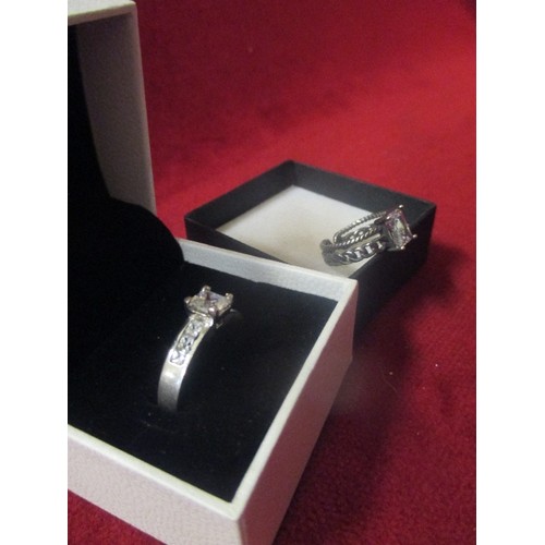 19 - TWO 925 SILVER RINGS, ONE WITH A SQUARE CUT CLEAR STONE AND ACCENT STONES ON THE SHOULDERS SIZE X IN... 