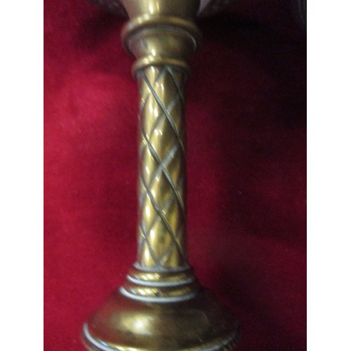 99 - A PAIR OF VINTAGE HEAVY BRASS CANDLESTICKS. POSSIBLY INDIAN.