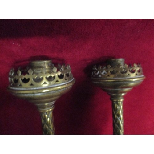 99 - A PAIR OF VINTAGE HEAVY BRASS CANDLESTICKS. POSSIBLY INDIAN.