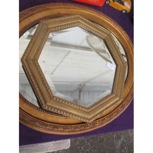 138 - 2 VINTAGE GILT FRAMED BEVELLED MIRRORS. AN OVAL AND A HEXAGONAL.