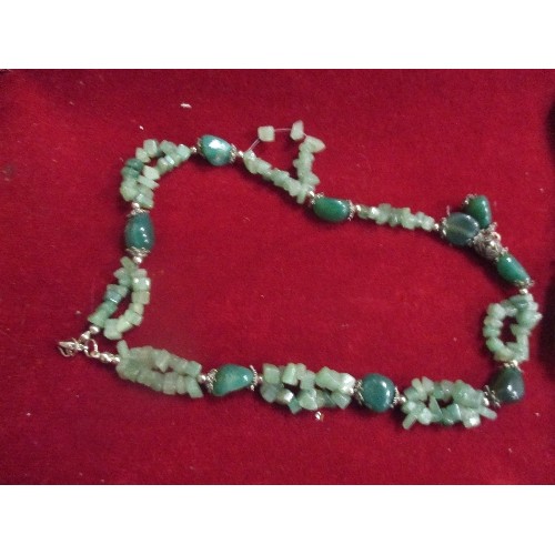 44 - AN ETHNIC STYLE BONE NECKLACE AND A GREEN GLASS BEAD NECKLACE REMINISCENT OF JADE