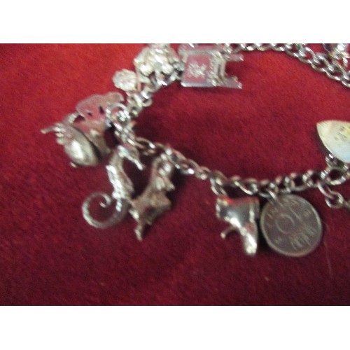 15B - A LOVELY VINTAGE STERLING SILVER CHARM BRACELET WITH APPROX 20 CHARMS - MOST WITH SILVER MARKS. SEVE... 