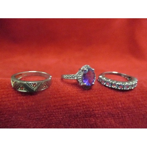 15E - 3 VINTAGE SILVER RINGS - ALL WITH PURPLE STONES, ONE SET IN A ZIG-ZAG DESIGN- ALL MARKED 925