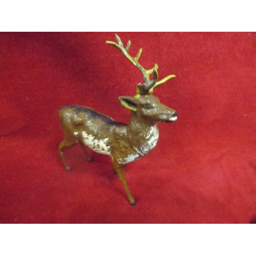 36A - FOUR EARLY 20TH CENTURY COLD PAINTED SPELTER STAGS, PROBABLY VIENNA. 3 HAVE DAMAGE OR REPAIRS. TALLE... 