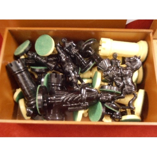 135 - 2 CHESS SETS. 1 SET IS CARVED WOOD (STAUNTON), THE OTHER IS GLOSS BLACK/CREAM. BOTH BOXED.