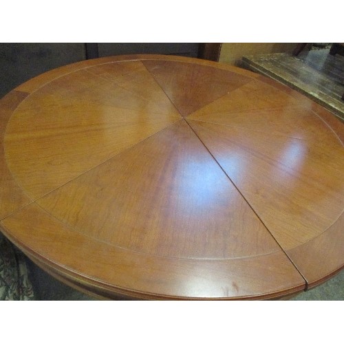 396 - A SUPERB EXPANDING CIRCULAR DINING TABLE AFTER 