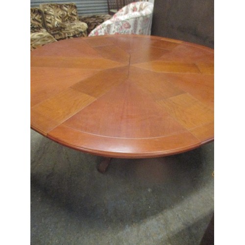 396 - A SUPERB EXPANDING CIRCULAR DINING TABLE AFTER 